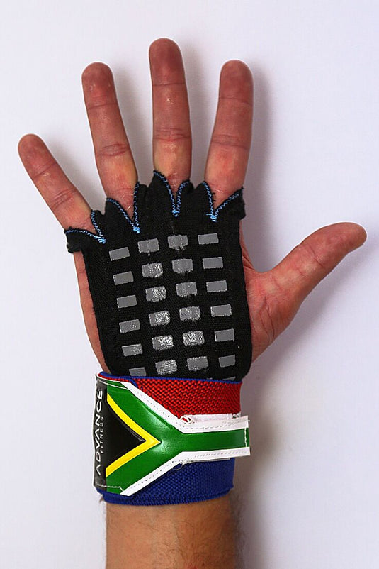 A close-up of a hand wearing a black fingerless grip glove with gray textured pads and a South African flag wrist wrap on a plain white background.